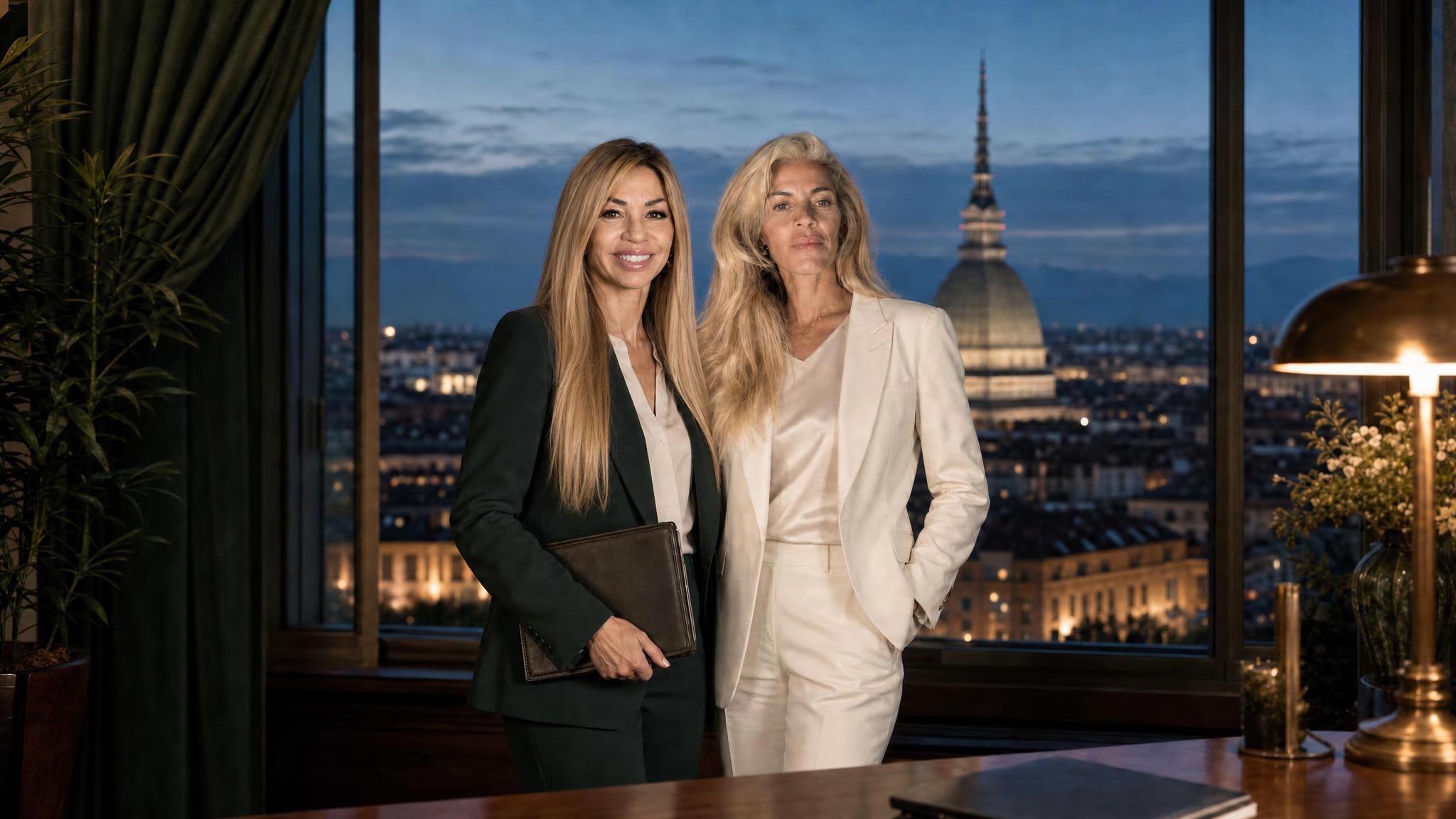 Nina e Andrea Catizone nello studio di Torino, con la Mole Antonelliana alle spalle